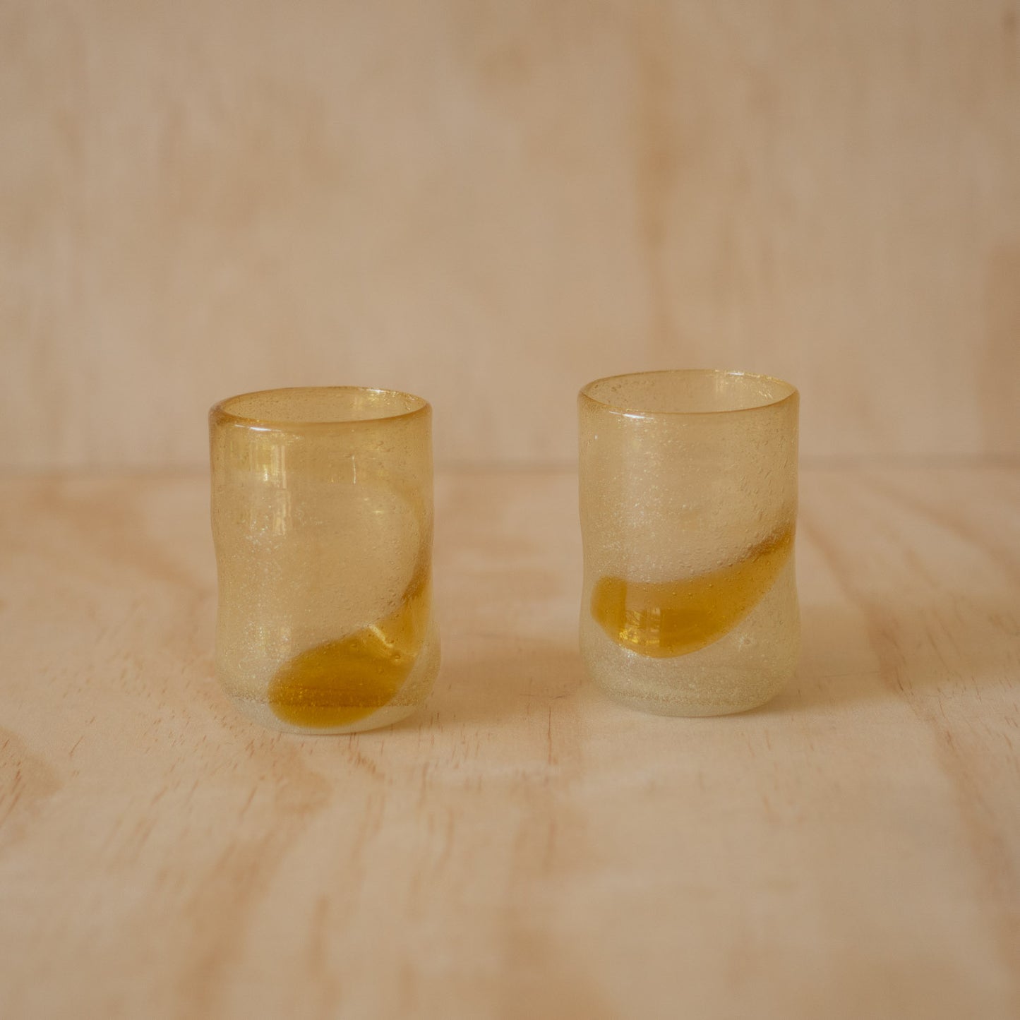 Japanese pair of hand blown glass tumblers - amber