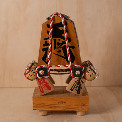 Vintage Japanese Folk Art Sculpture - Kokeshi holding giant Shogi Chess piece