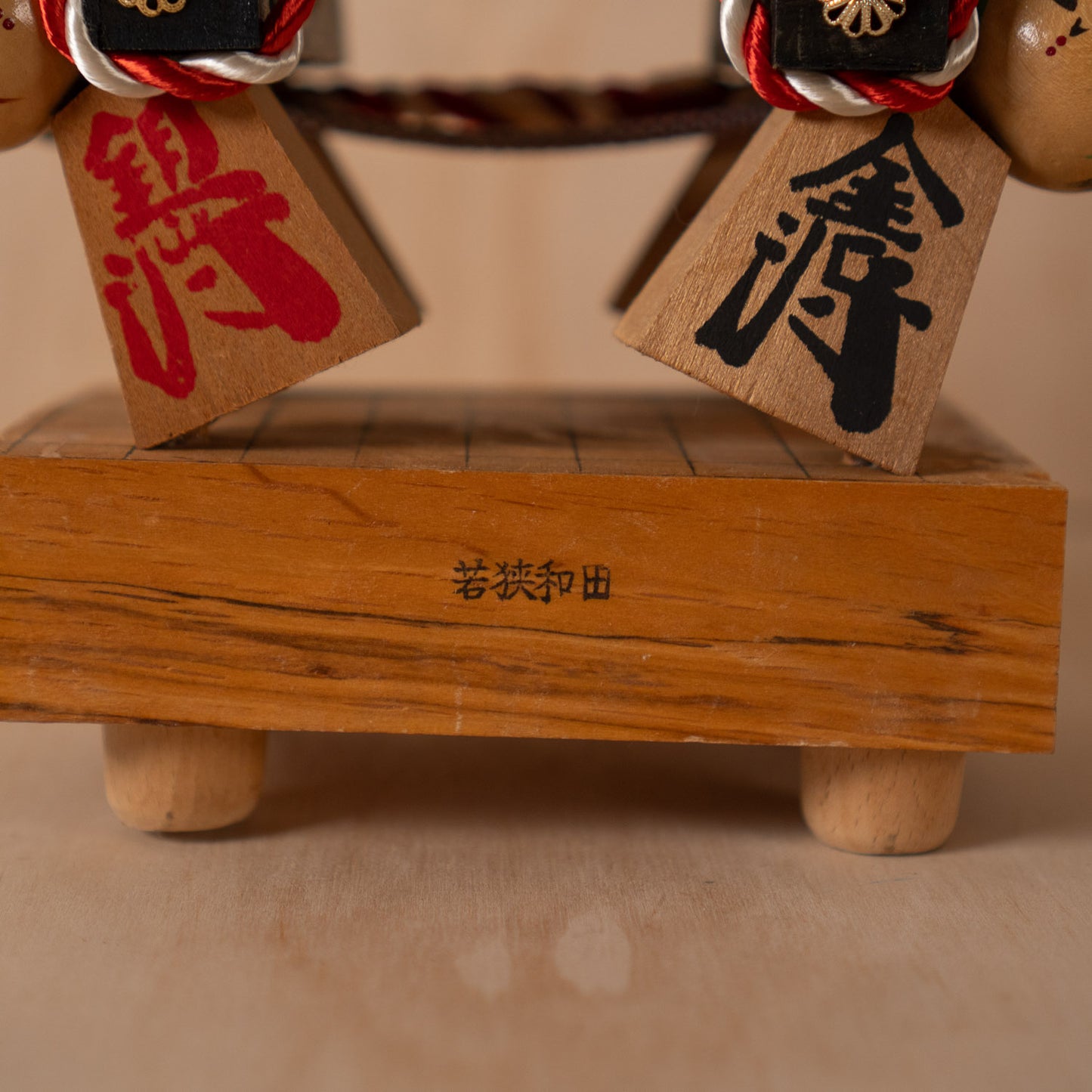 Vintage Japanese Folk Art Sculpture - Kokeshi holding giant Shogi Chess piece