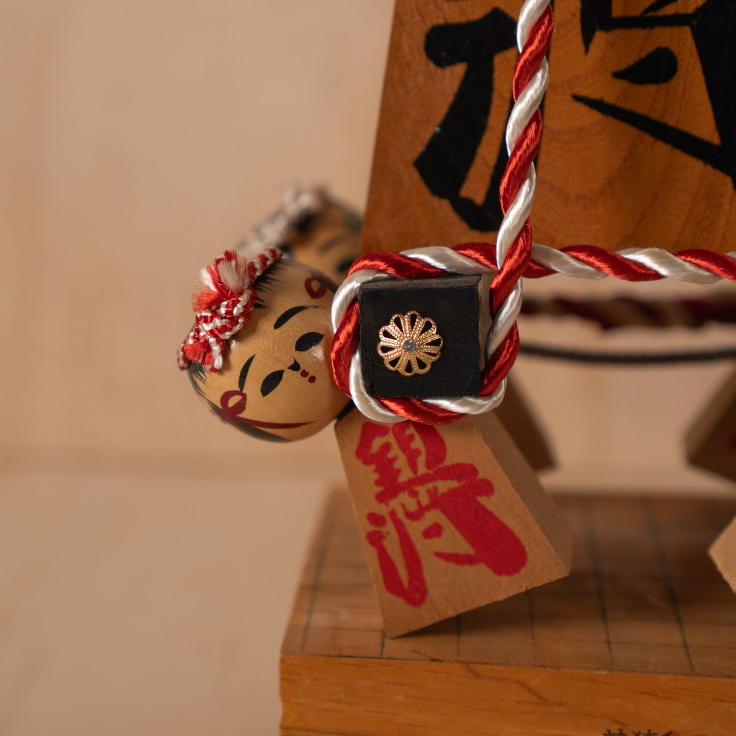 Vintage Japanese Folk Art Sculpture - Kokeshi holding giant Shogi Chess piece