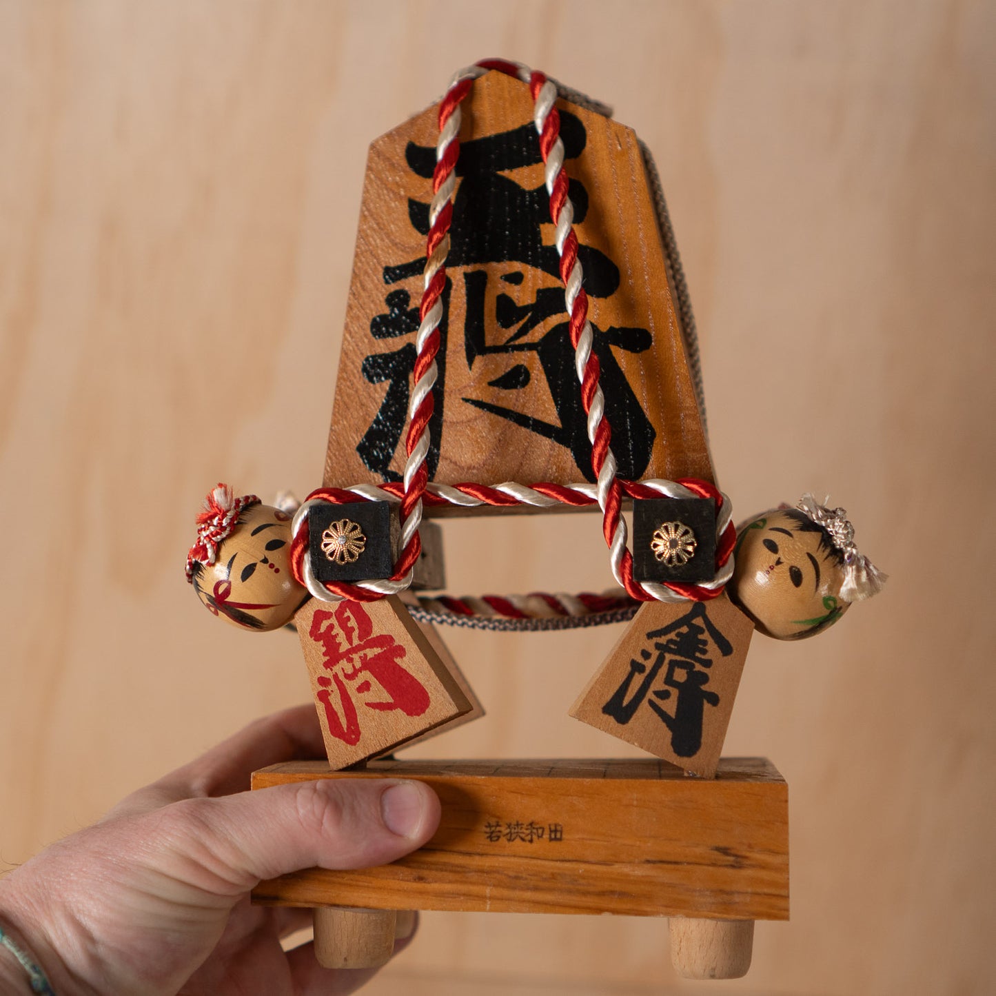 Vintage Japanese Folk Art Sculpture - Kokeshi holding giant Shogi Chess piece